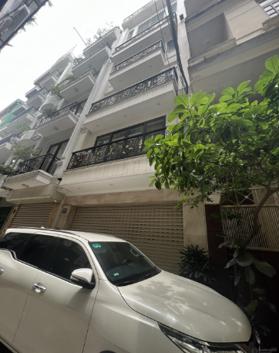 Bán tòa văn phòng phố Hào Nam - Hoàng Cầu, 70m2 x 8T. MT ~6m. 28.5 tỷ, ô tô tránh, kinh doanh