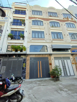 Nhà 2 mặt tiền hẻm 6m, xe hơi đậu trong nhà, Phan Huy Ích - P14 - 4x10m 4 lầu 4PN 4WC=6,5 tỷ