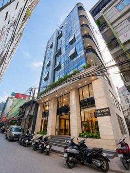 BÁN TÒA NHÀ ĐƯỜNG LÊ VĂN LƯƠNG. 110M2 - 10 TẦNG. THANG MÁY. MT 12M.