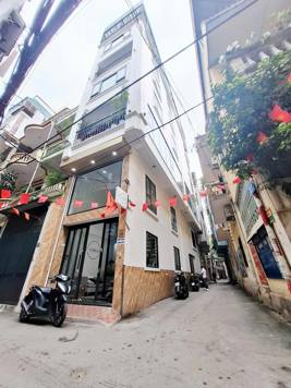 BÁN NHÀ ĐƯỜNG VƯƠNG THỪA VŨ. 60M2 - 8 TẦNG. THANG MÁY. LÔ GÓC. GARA Ô TÔ.